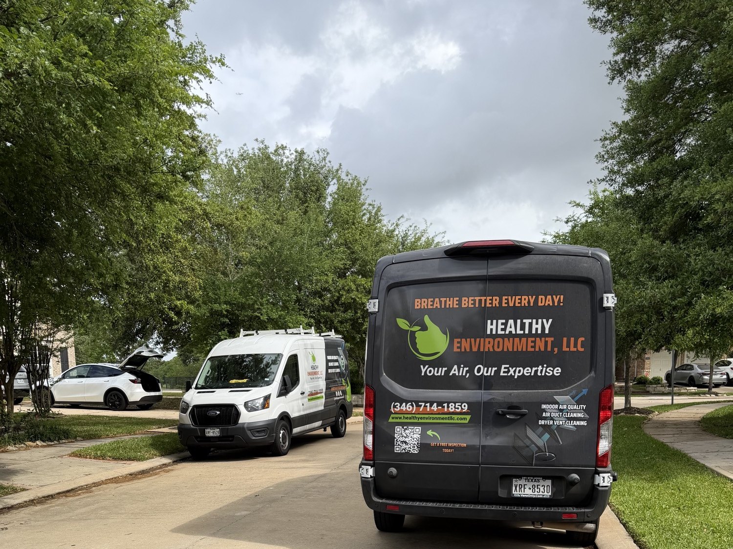 Healthy Environment air duct cleaning vans in a Sugar Land neighborhood